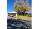 Ranch style home with carport and mature tree in front yard at 5520 Eugene Ave, Las Vegas, NV 89108