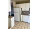 White kitchen cabinets and appliances, tile floor at 5520 Eugene Ave, Las Vegas, NV 89108