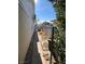 Side yard with pathway, gravel, and chain link fence at 5520 Eugene Ave, Las Vegas, NV 89108