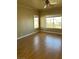 Large bedroom with laminate wood flooring and ceiling fan at 5758 Yellowcrest Ct, Las Vegas, NV 89113