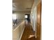 Upstairs hallway with hardwood floors and access to bedrooms at 5758 Yellowcrest Ct, Las Vegas, NV 89113