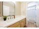 Clean bathroom with single sink vanity, and a separate tub and shower at 5900 Negril Ave, Las Vegas, NV 89130