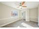 Well-lit bedroom with mirrored closet doors and a ceiling fan at 5900 Negril Ave, Las Vegas, NV 89130