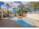 Resort-style pool and spa surrounded by palm trees at 5900 Negril Ave, Las Vegas, NV 89130