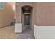 Dark-colored front door with a brick walkway and stone accents at 6427 Terra Miranda Ave, Las Vegas, NV 89118