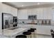 Spacious kitchen with white cabinetry and granite at 712 Rogue Wave St, Las Vegas, NV 89138