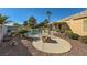 Backyard with fire pit, pool, and spacious patio area at 7200 Rustic Meadow St, Las Vegas, NV 89131