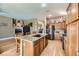 Kitchen with granite countertops, wooden cabinets, and island seating at 7200 Rustic Meadow St, Las Vegas, NV 89131