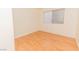 Bright bedroom with wood-look flooring and a large window at 8600 W Charleston Blvd # 1125, Las Vegas, NV 89117