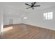 Bright bonus room with wood-look floors, ceiling fan, and multiple windows at 8645 Edmond St, Las Vegas, NV 89139