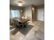 Formal dining room with a square table and six chairs at 9144 Sea Mink Ave, Las Vegas, NV 89149