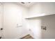 Laundry room with white cabinets and shelving at 10968 Fintry Hills St, Las Vegas, NV 89141