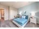 Bedroom with a queen bed and light blue walls at 1125 Green Lovebird St # 550, Henderson, NV 89011