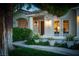 Inviting home exterior with lush landscaping and well-lit entryway at 2003 Grafton Ave, Henderson, NV 89074