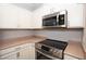 Modern kitchen with stainless steel appliances and light cabinets at 2151 Hussium Hills St # 207, Las Vegas, NV 89108