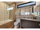 Modern bathroom with glass shower, vanity, and neutral color scheme at 32 Highland Cove Ln, Henderson, NV 89011