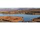 Lakefront community with homes, boat docks, and mountain backdrop at 32 Highland Cove Ln, Henderson, NV 89011