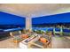 Infinity pool with fire pit and breathtaking views at night at 32 Highland Cove Ln, Henderson, NV 89011