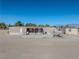 Manufactured home with covered patio and fenced backyard, mountain views at 3581 W Dyer Rd, Pahrump, NV 89048