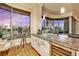 Wet bar with granite countertop, wine cooler, and city views at 360 E Desert Inn Rd # 404, Las Vegas, NV 89109