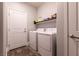 Convenient laundry room with washer, dryer, and shelving at 363 Terrill Ave, Las Vegas, NV 89183