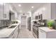 Modern kitchen with white cabinets and gray tile backsplash at 509 Crepes Pl, Henderson, NV 89052