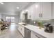 Modern kitchen with white shaker cabinets and quartz countertops at 509 Crepes Pl, Henderson, NV 89052