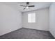 Bright bedroom with ceiling fan and grey carpet at 6288 Dolosonte St, Las Vegas, NV 89113