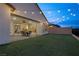 Covered patio with string lights, seating, and a view into the house at 6544 Corsari Ridge St, Las Vegas, NV 89166