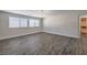 Spacious bedroom with wood-look floors and walk-in closet at 6608 Fort William St, North Las Vegas, NV 89084