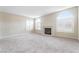 Living room with neutral walls, carpeted floor, and fireplace at 8405 Sewards Bluff Ave, Las Vegas, NV 89129