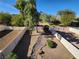 Spacious backyard with a rock garden and trees at 85 Day Trade St # 2, Henderson, NV 89074