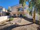 Private backyard with patio, rock landscaping, and a fenced area at 85 Day Trade St # 2, Henderson, NV 89074