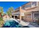 Stunning pool, patio, and two-story house view at 9747 Logrondo St, Las Vegas, NV 89178