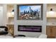 Elegant living room featuring a linear fireplace and built-in shelving at 1905 Crown Lodge Ln, North Las Vegas, NV 89084