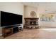 Living room features a fireplace and large flat-screen TV at 1981 Labrador St, Pahrump, NV 89048