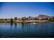 Lake view with homes and mountains in the background at 2821 Vista Butte Dr, Las Vegas, NV 89134