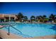 Resort-style pool with lounge chairs and umbrellas at 2821 Vista Butte Dr, Las Vegas, NV 89134