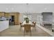 Spacious dining room with light wood table and modern chandelier at 293 Helmsdale Dr, Henderson, NV 89014