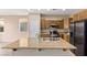 Kitchen island with granite countertop and stainless steel sink at 324 Trailing Putt Way, Las Vegas, NV 89148