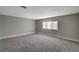 Spacious bedroom with gray walls and gray carpeting at 3700 Edison Ave, Las Vegas, NV 89121