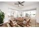 Open concept dining room with view into kitchen and living room at 400 Mill Hollow Rd, Las Vegas, NV 89107