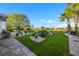 Artificial turf and stone landscaping in backyard at 4660 Fiore Bella Blvd, Las Vegas, NV 89135