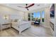 Spacious bedroom with large windows, ceiling fan, and fireplace at 4660 Fiore Bella Blvd, Las Vegas, NV 89135