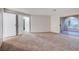 Bright bedroom with carpet flooring and sliding door to balcony at 5181 Pioneer Ave # 101, Las Vegas, NV 89146