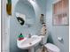 Small bathroom with pedestal sink and toilet at 5527 Breecher Ave, Las Vegas, NV 89131