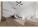 Light and airy living room with hardwood floors and ceiling fan at 6564 Sweetzer Way, Las Vegas, NV 89108