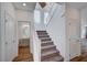 Modern staircase with light-colored wood railing and carpeted steps at 8731 Black Cordon Rd, Las Vegas, NV 89139