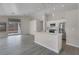 Modern kitchen with white cabinets, stainless steel appliances, and island at 901 Quicksand Ln, North Las Vegas, NV 89032