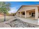 Landscaped backyard with a stone bridge and rock water feature at 9092 National Park Dr, Las Vegas, NV 89178